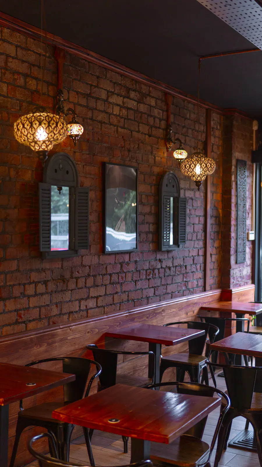 Lanterns along the brick wall